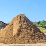 homeguide-dump-truck-load-of-screened-sand-in-pile